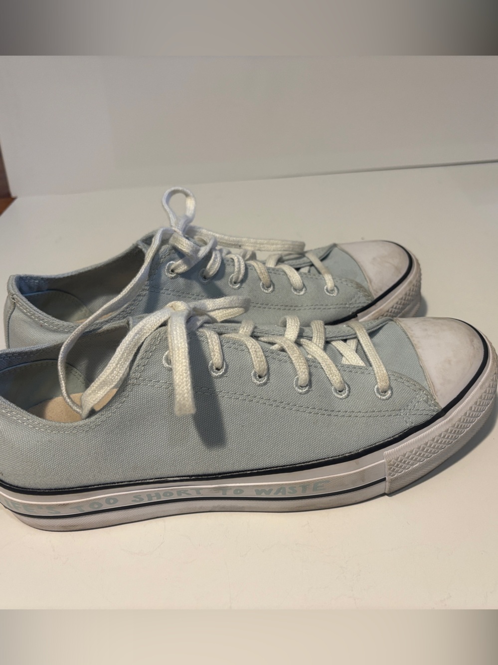 Converse Low Top Canvas Sneakers in Light Blue “Life’s too short to waste”